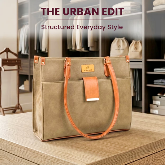 Brown handbag with orange accents on a wooden surface, with 'The Urban Edit' branding.