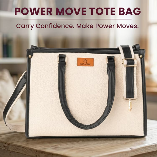 Beige tote bag with black handles and strap on a wooden surface, with 'Power Move Tote Bag' text above.