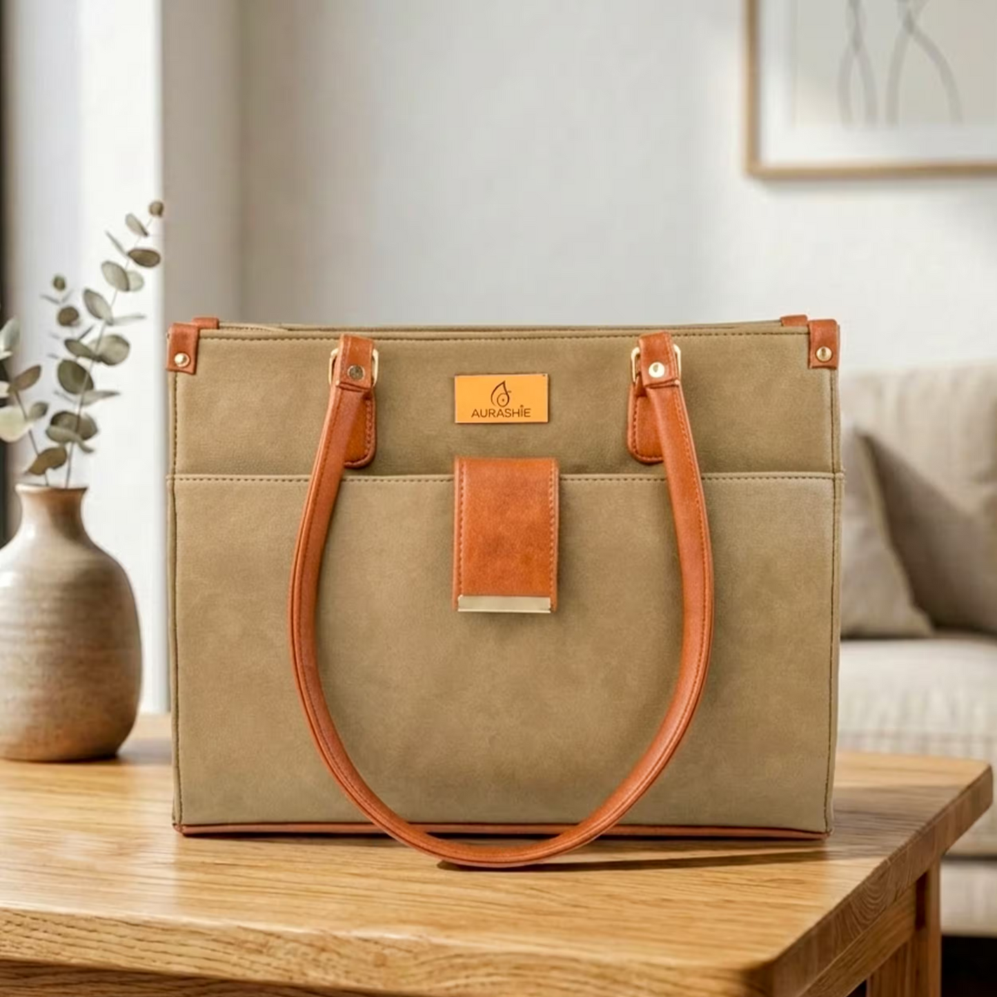 Green handbag with brown handles on a wooden table in a home setting