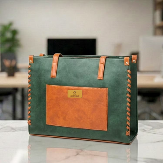 Green and brown tote bag on a marble surface with a blurred indoor background