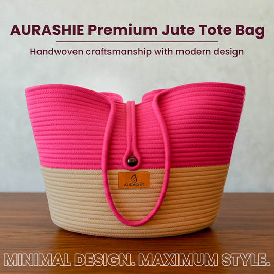 Pink and beige jute tote bag with 'AURASHIE' branding on a wooden surface.