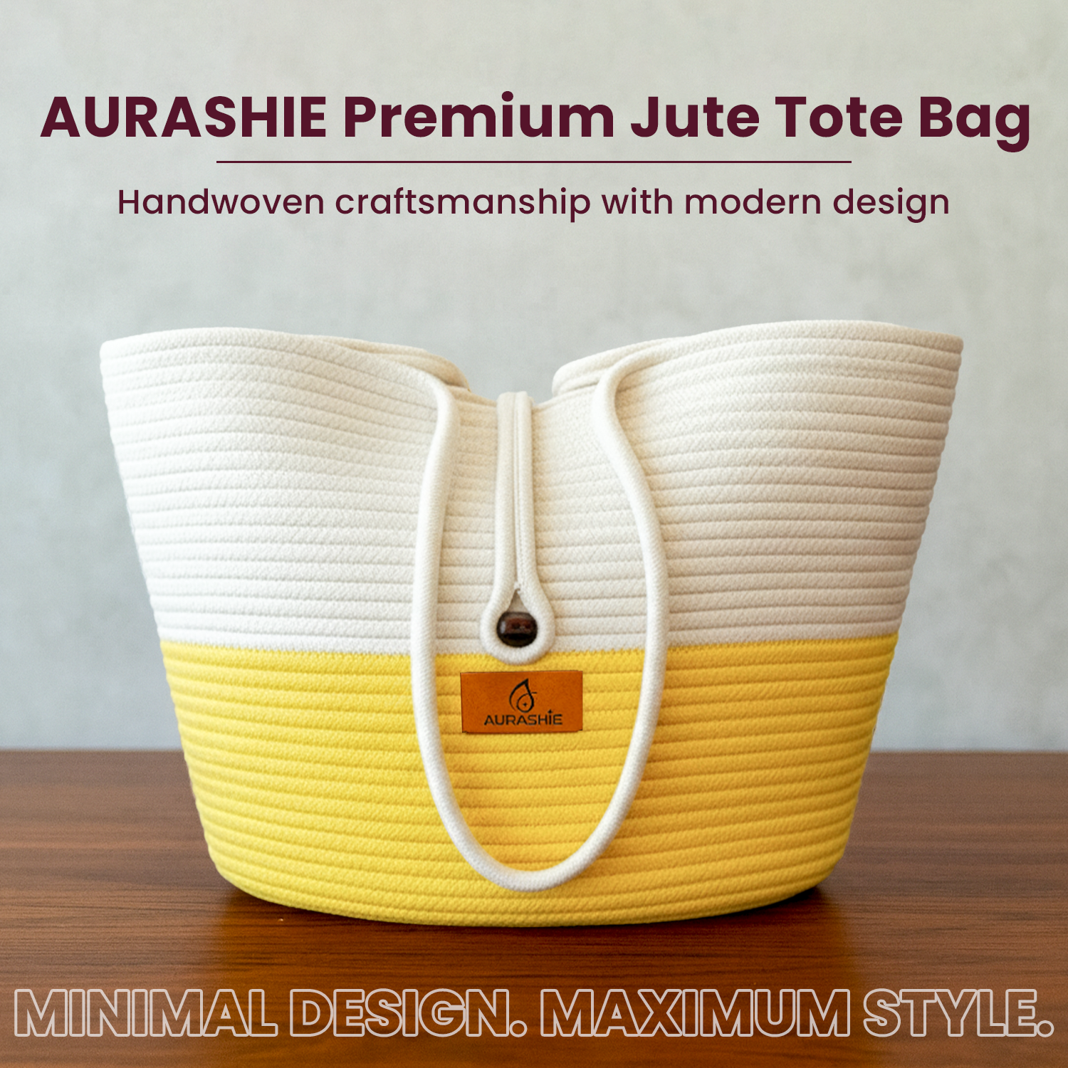 Yellow and white jute tote bag with 'AURASHIE' branding on a wooden surface.