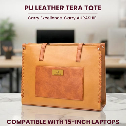 Brown PU leather tote bag with 'AURASHIE' brand logo on a blurred office background.