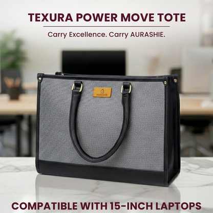 Gray and black Texura Power Move Tote bag on a desk with blurred office background