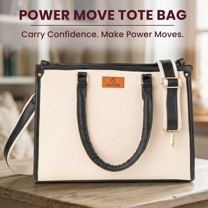 Beige tote bag with black handles and strap on a wooden surface, with 'Power Move Tote Bag' text above.