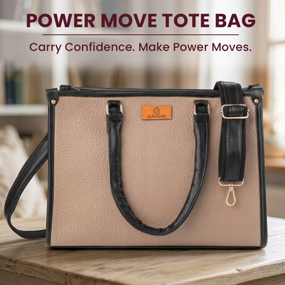 Beige tote bag with black handles and strap on a wooden surface, with 'Power Move Tote Bag' text above.