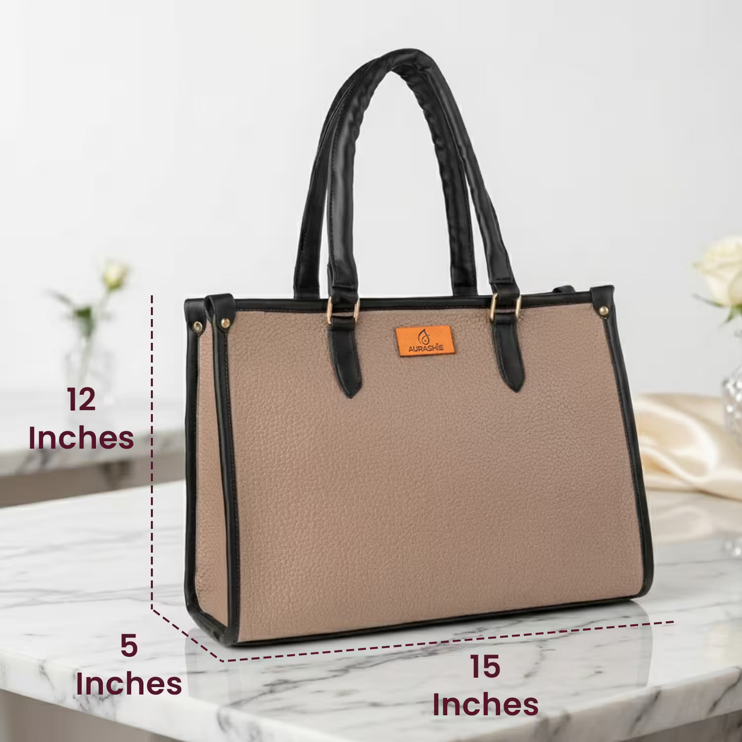 Beige handbag with black handles and trim on a marble surface, with measurements indicated.