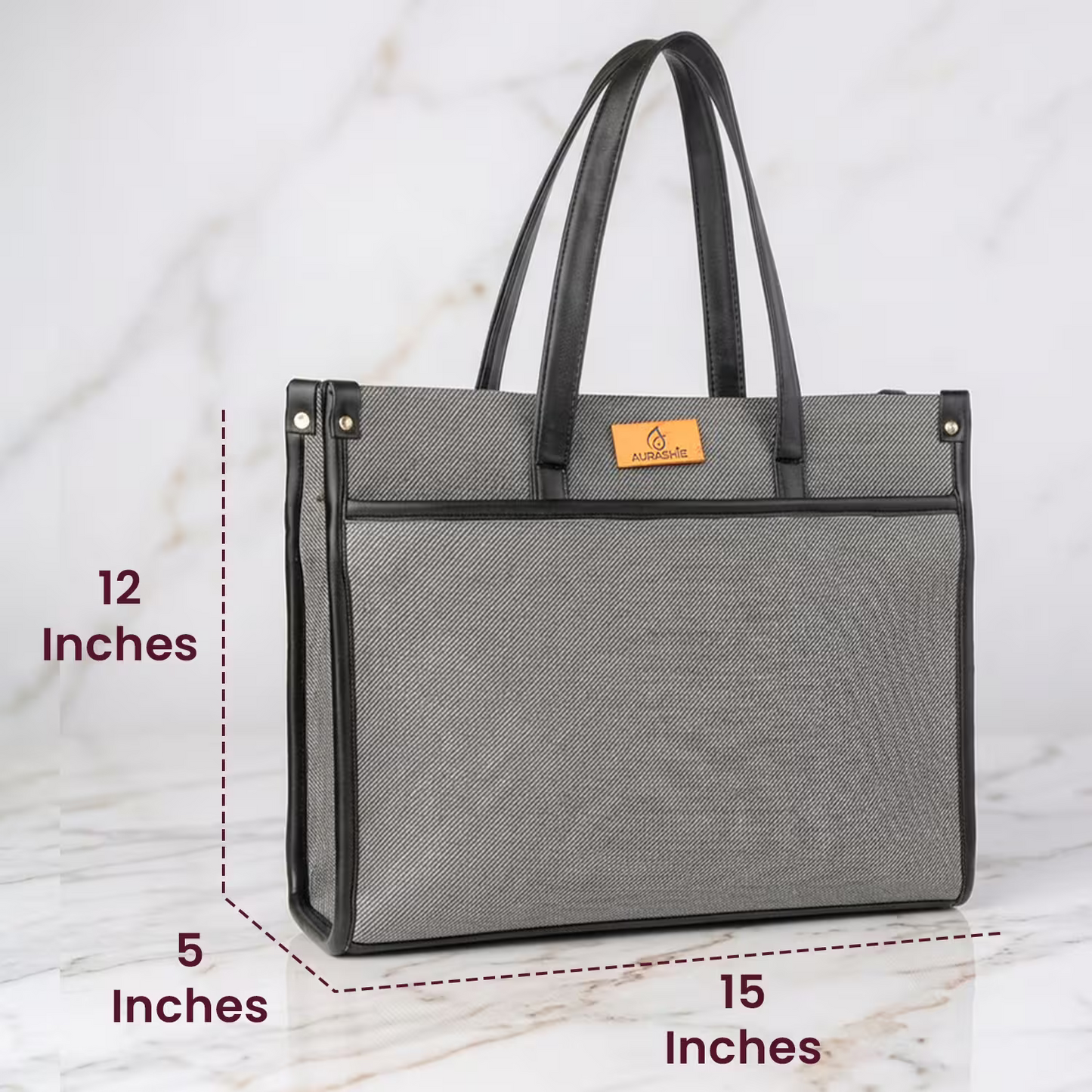 Gray tote bag with dimensions labeled on a marble background