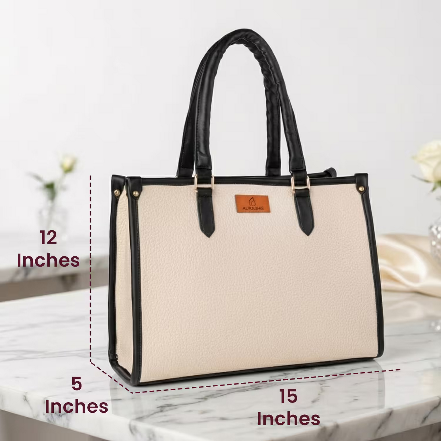 Beige handbag with black handles and trim on a marble surface, with dimensions labeled.