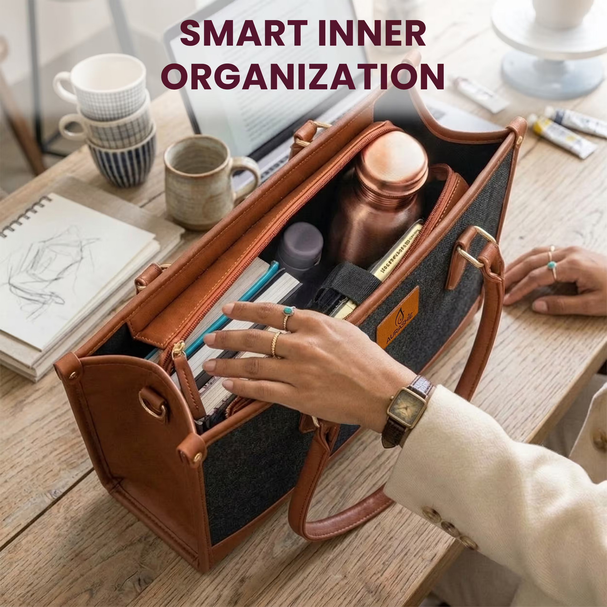 Handbag with organized contents on a desk, with text 'Smart Inner Organization'.