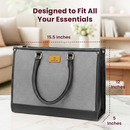 Gray tote bag with measurements and text on a blurred indoor background