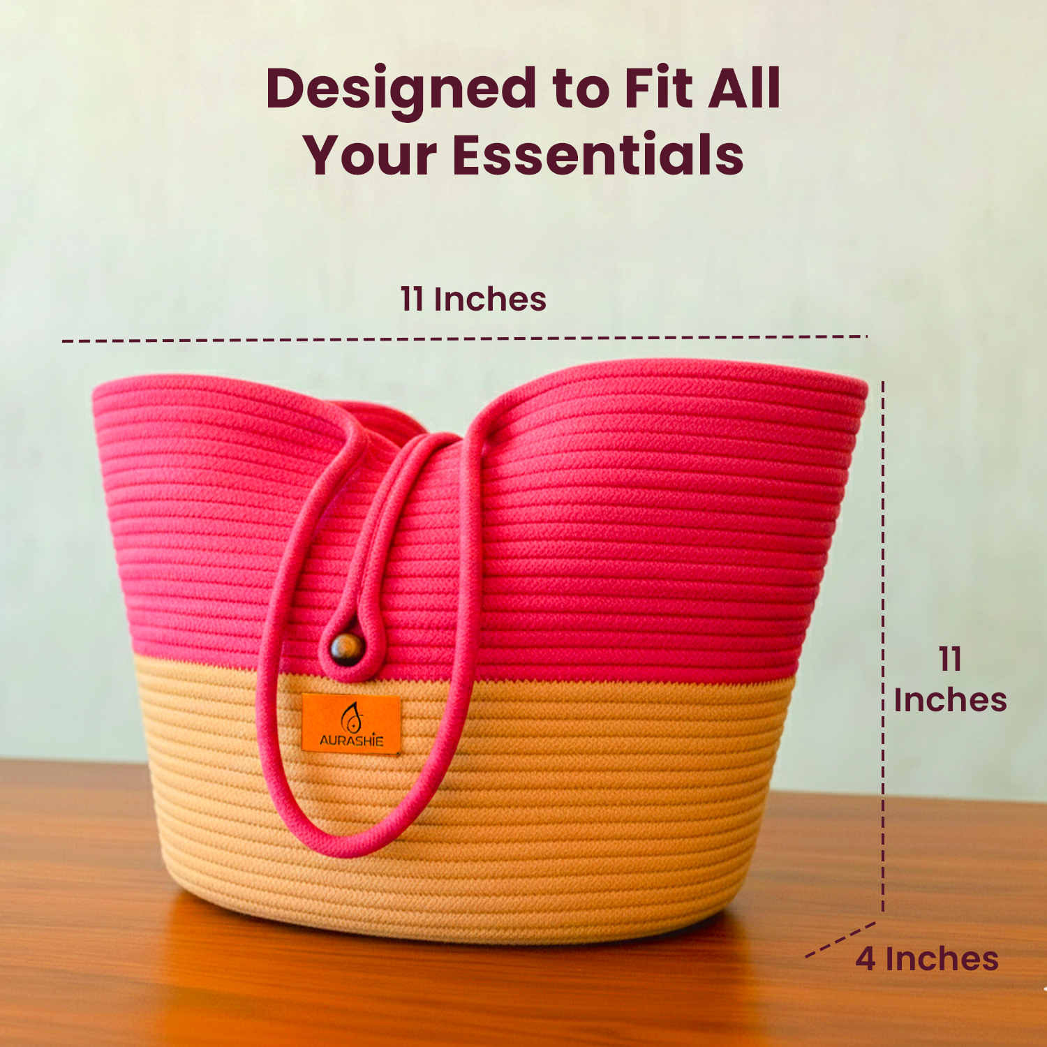 Pink and beige woven bag with dimensions on a wooden surface